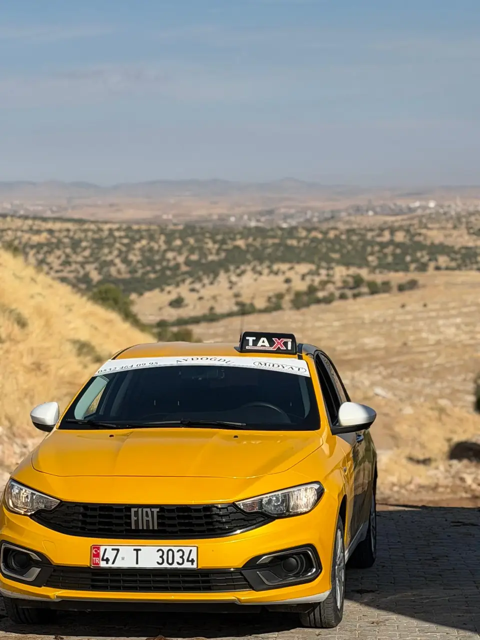 Uzun yola hazır sarı Fiat Egea taksi